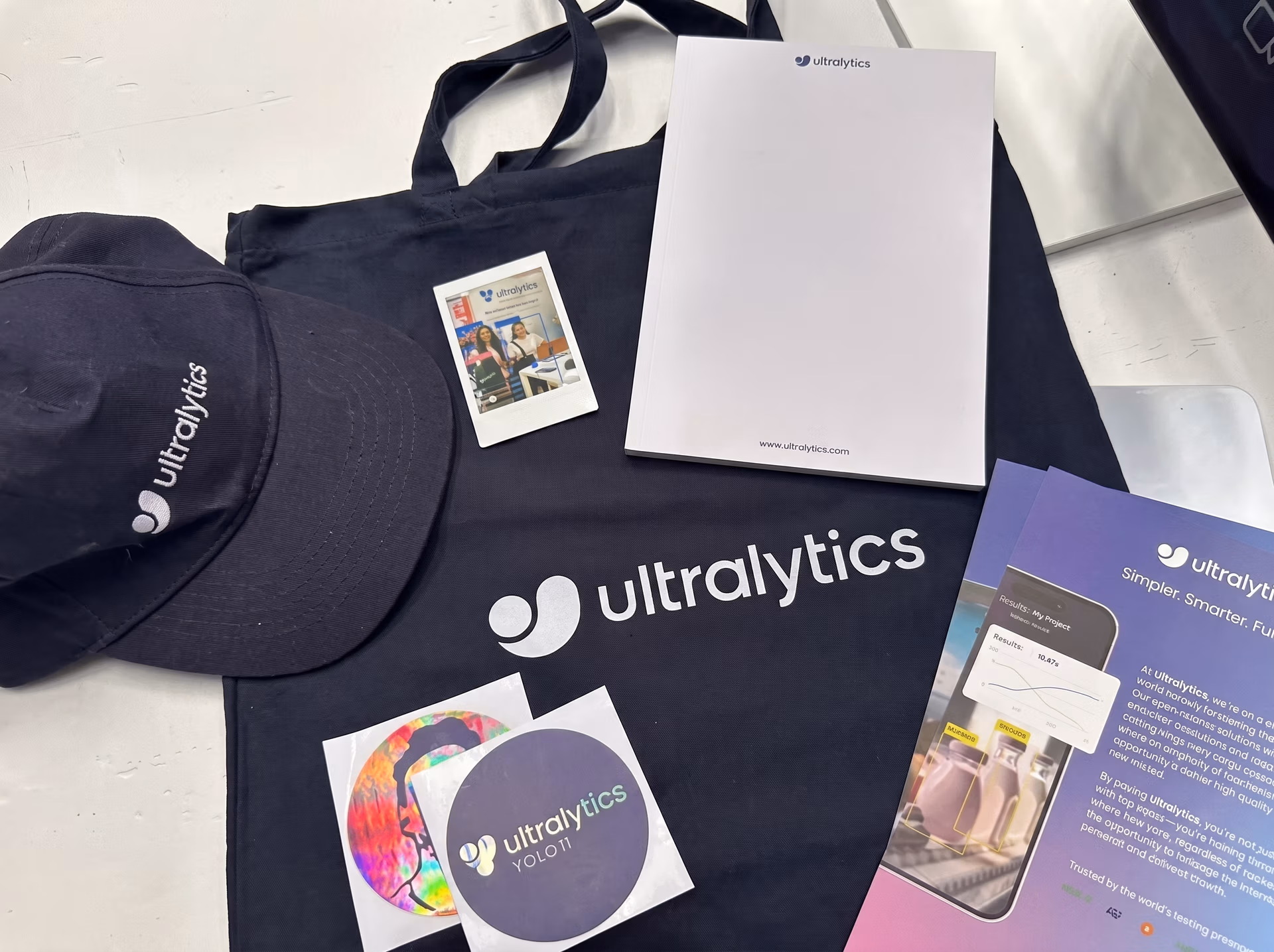 Attendees enjoying the Ultralytics merchandise