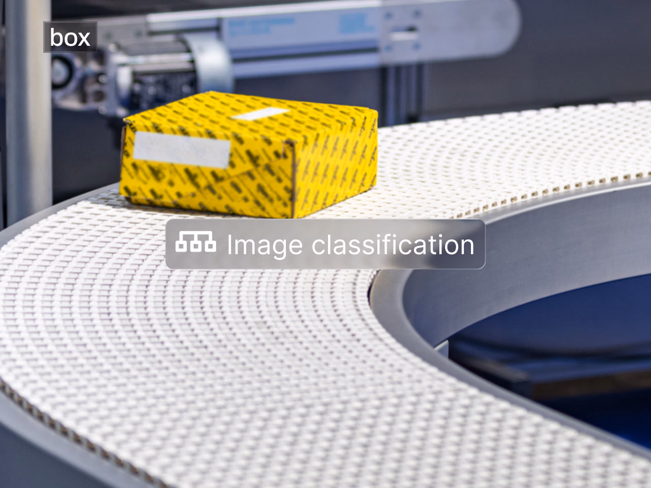 Image classification: yellow package on a curved conveyor belt, classified as box.