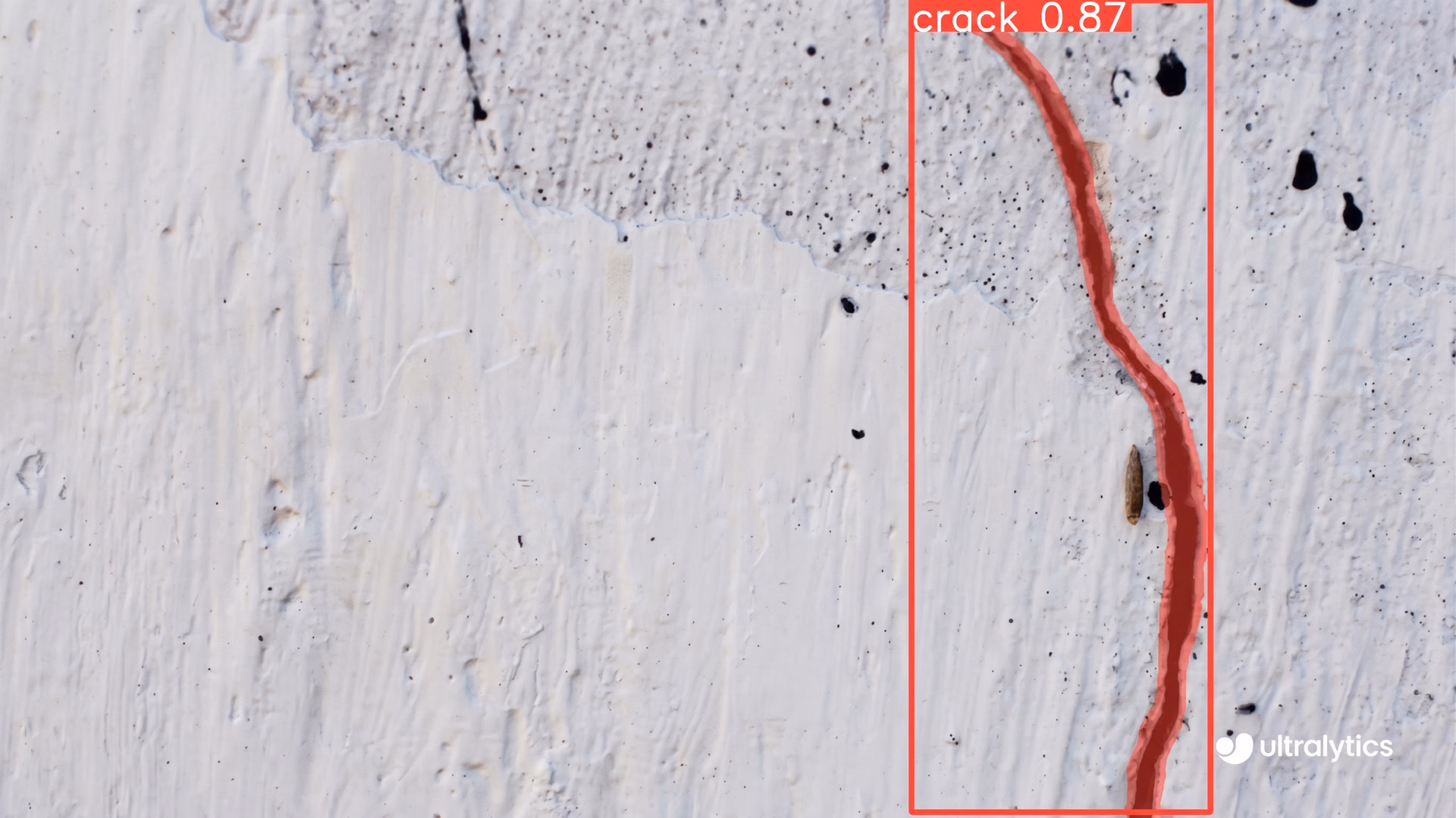Ultralytics YOLO11 segmenting a crack in a concrete wall