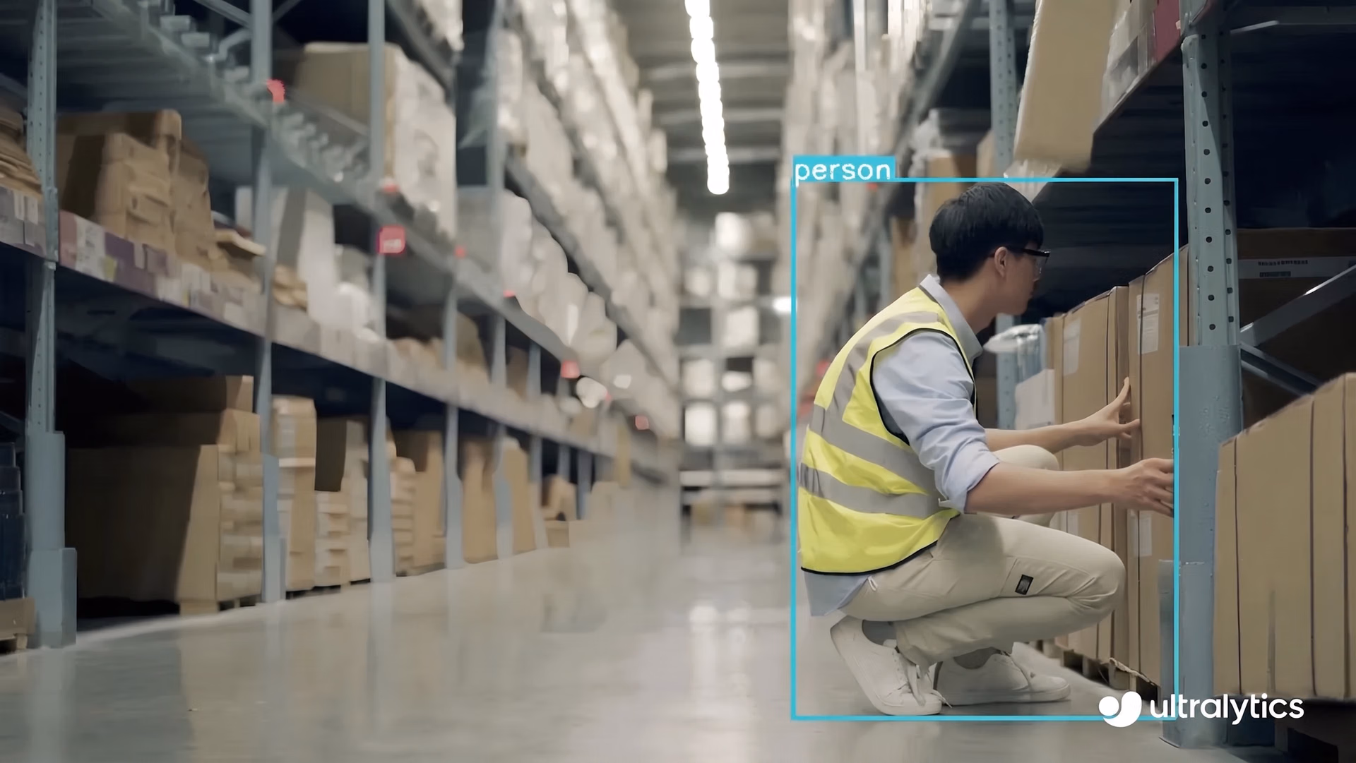 Ultralytics YOLO11 detecting a worker in a warehouse