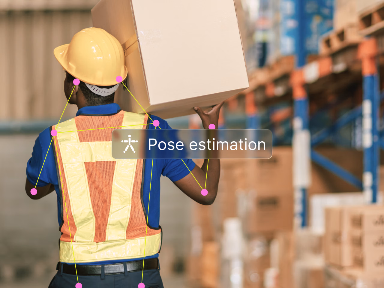 Pose estimation: warehouse worker in a hard hat and safety vest carrying a box on one shoulder, with body keypoints joined into a skeleton.