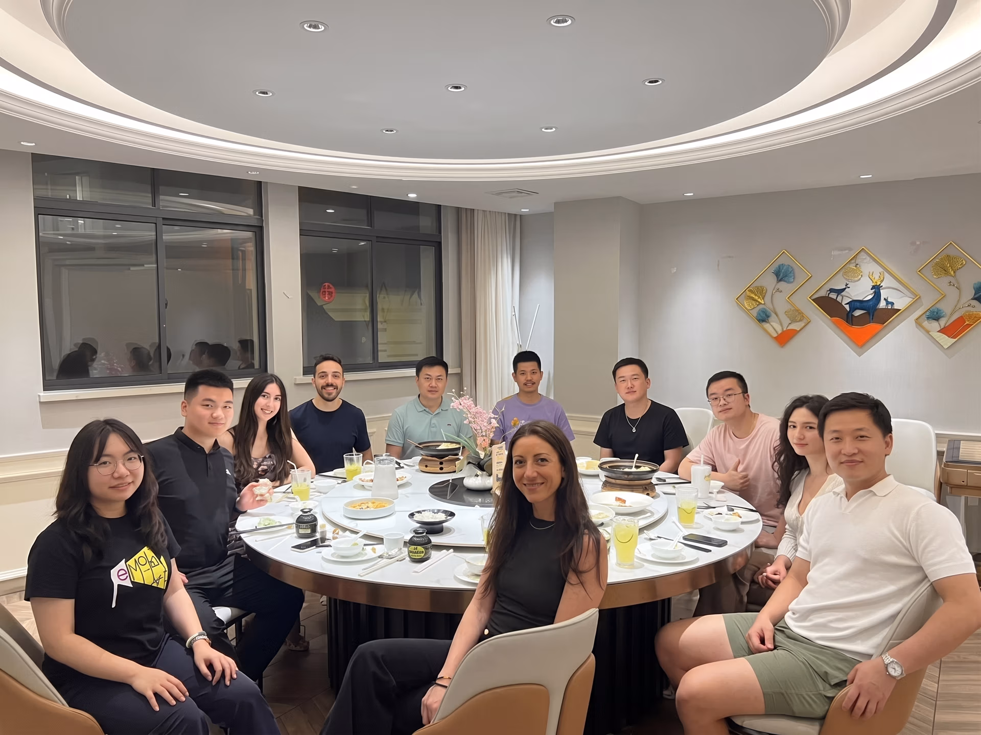 The Ultralytics team at dinner with members from D-Robotics and Hugging Face