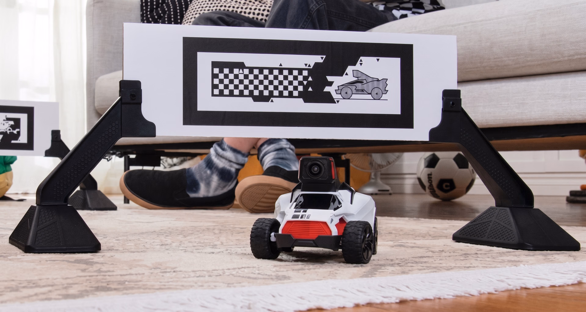 RC car equipped with a camera in front of a fiducial marker