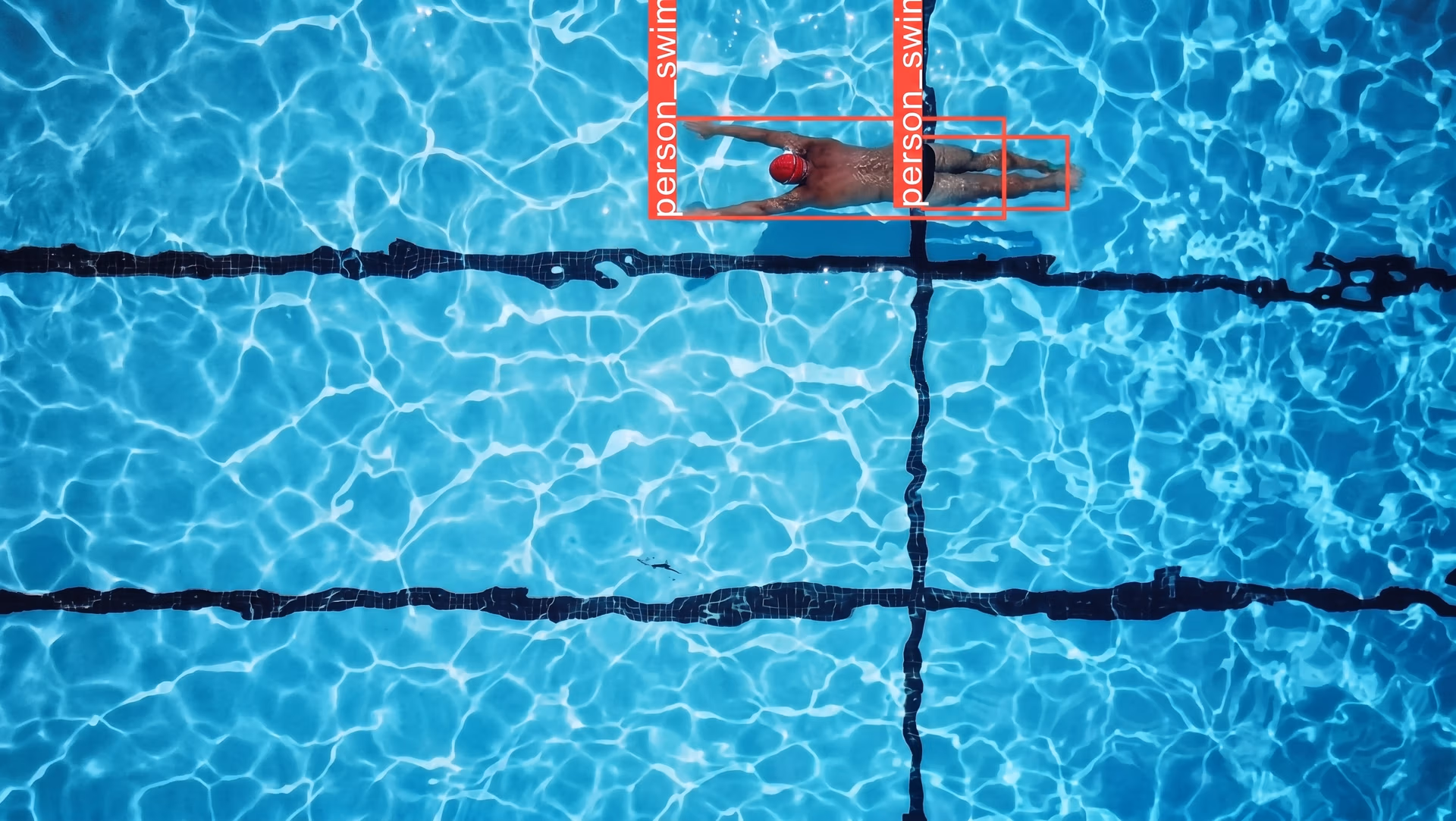 YOLO11 identifying and tracking swimmers in real time