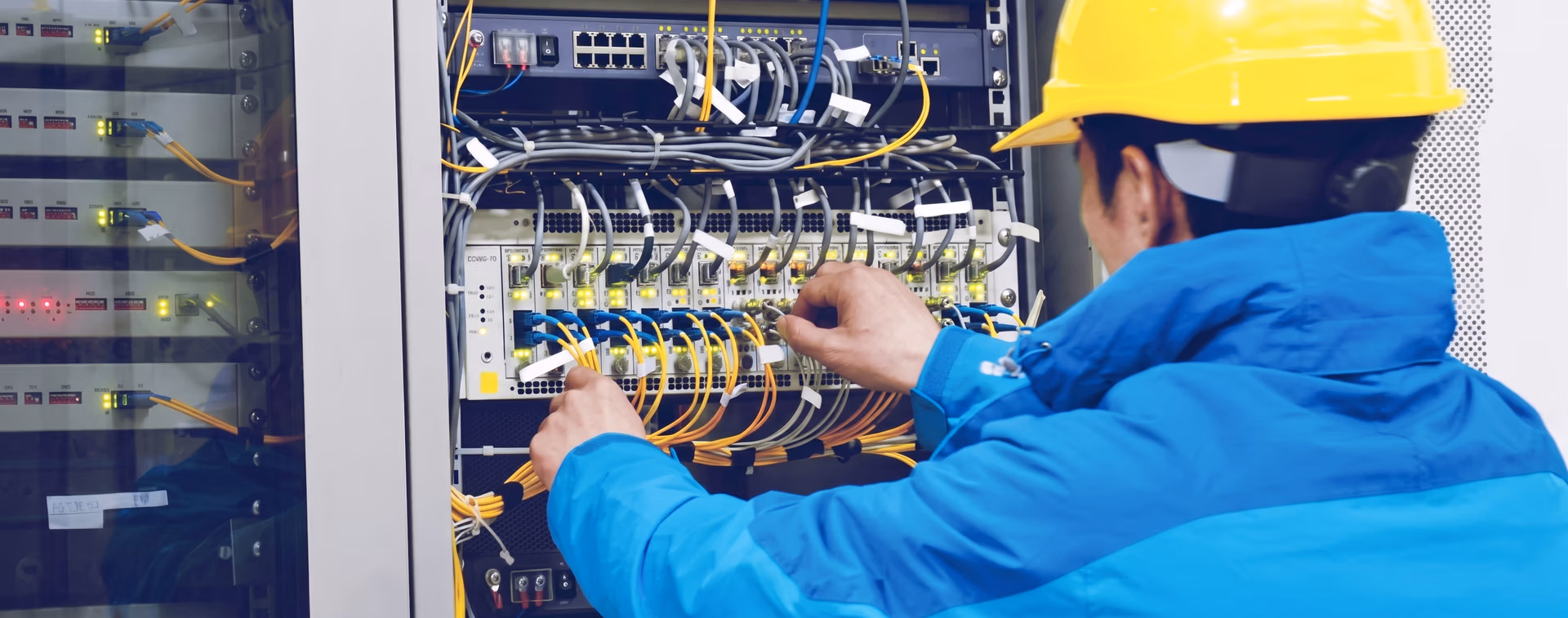 An OSP engineer working on fiber optic infrastructure