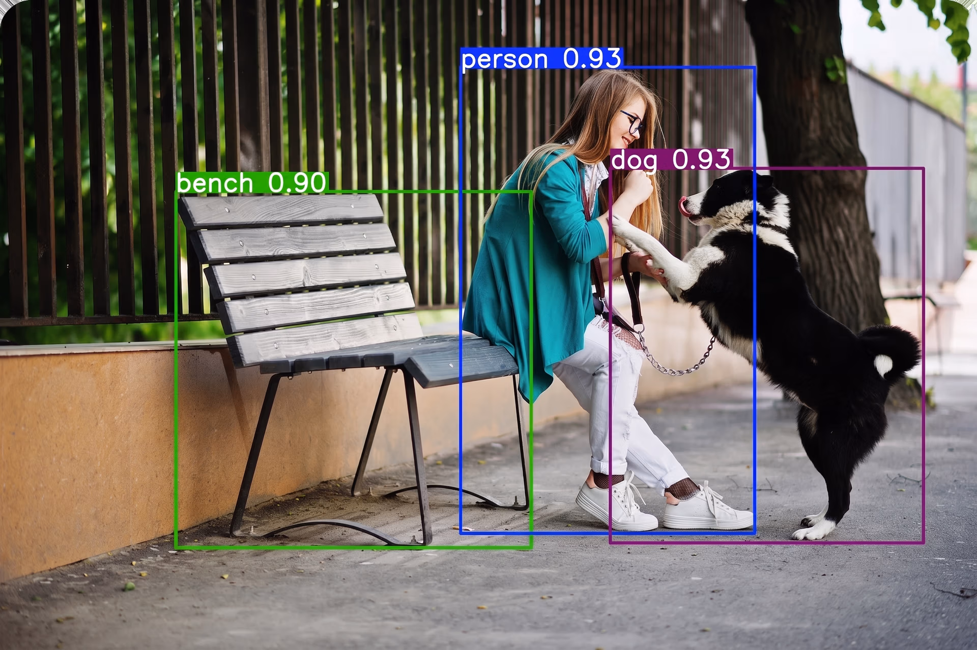 Detecting a person, a dog, and a bench in a city using Ultralytics YOLO26