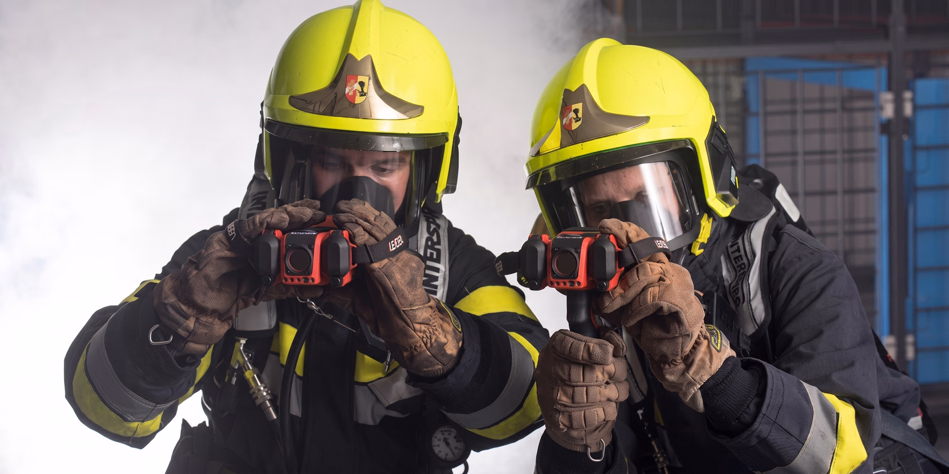 Firefighters using thermal cameras to find hotspots