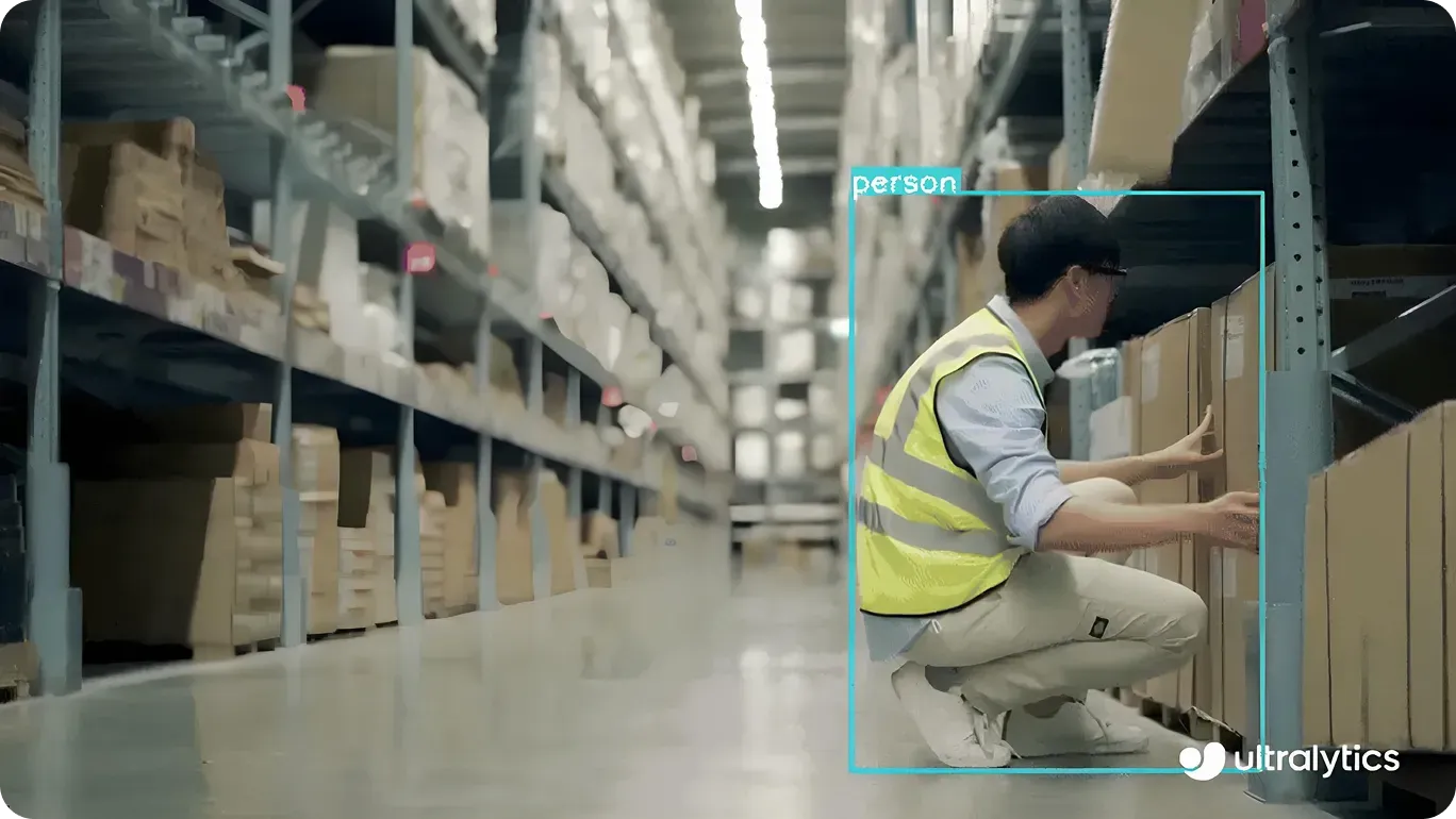 YOLO11 detecting a worker in a warehouse