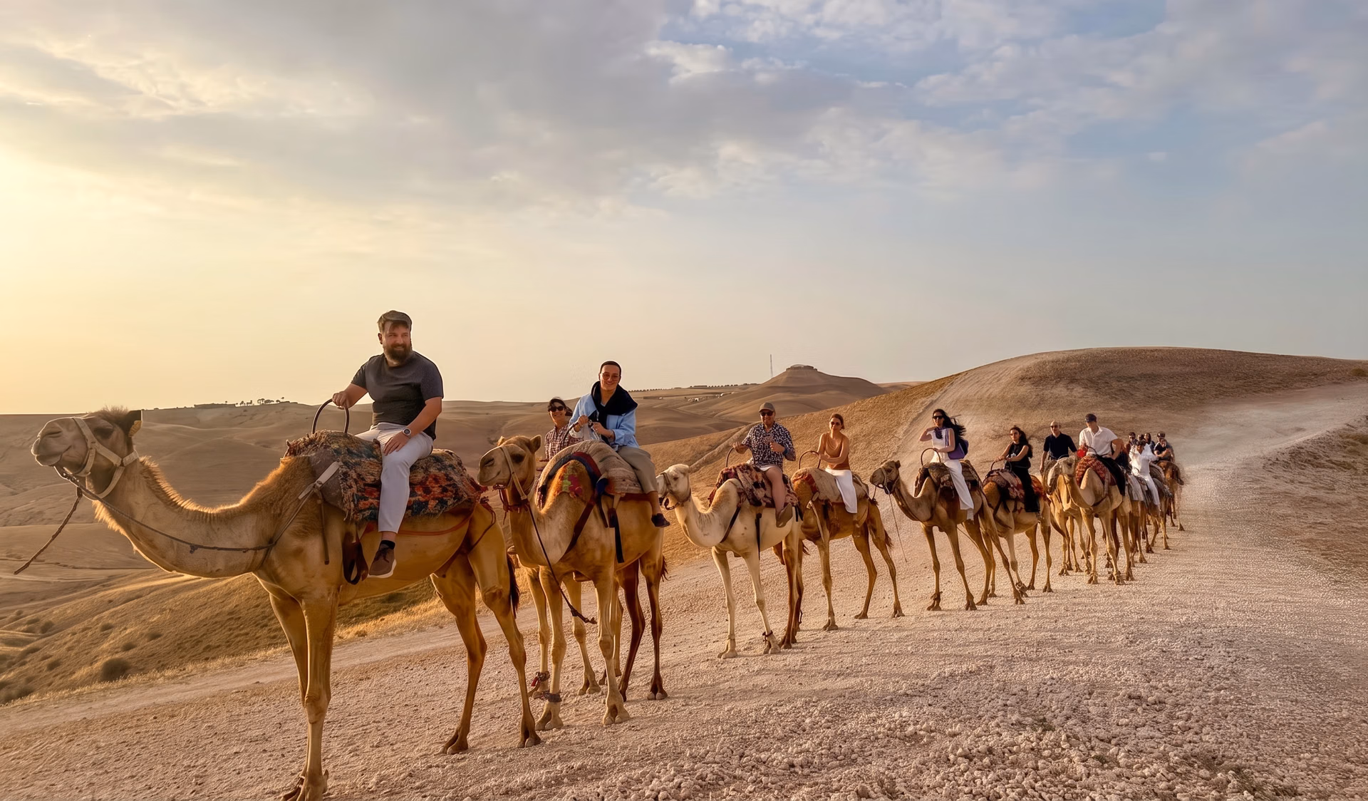 Ultralytics team riding camels at a company offsite