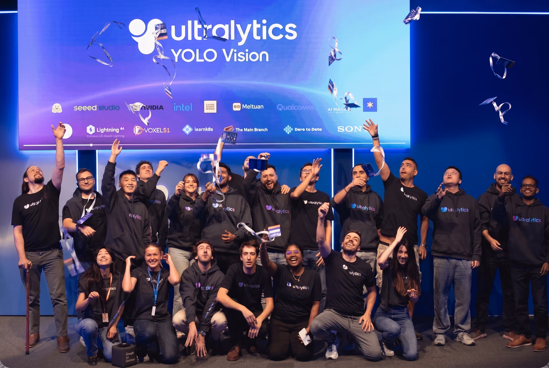 The Ultralytics team celebrating at YOLO Vision 2024