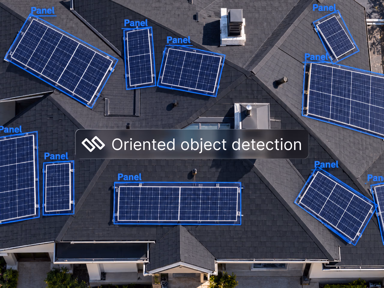 Oriented object detection (OBB): aerial view of solar panels on a dark shingled roof, each detected with a rotated box labeled Panel.